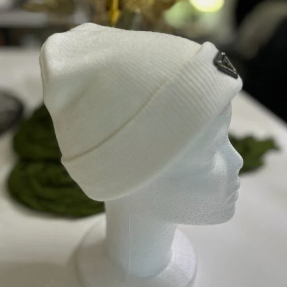 White Knitted Hat with Lapel and Decorative Emblem
